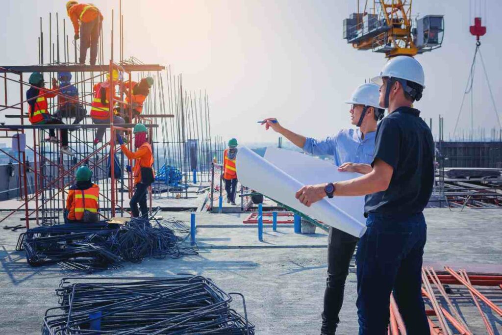 An Architect & Engineer On Top Of The Roof Of A Building