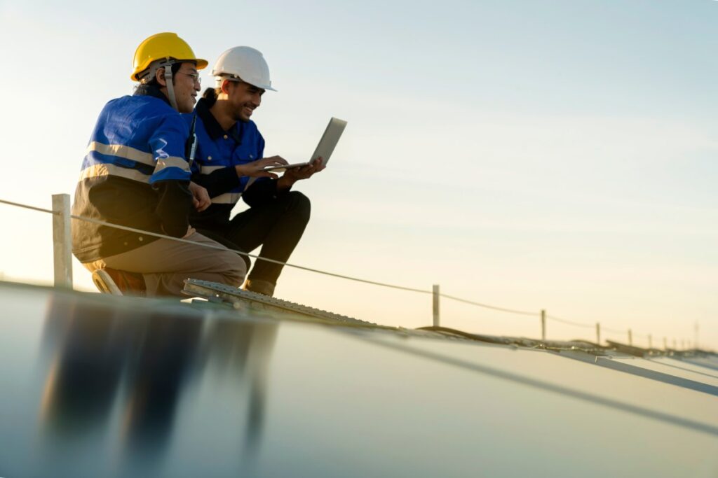 Building Maintenance Specialists Checking On Solar Panels