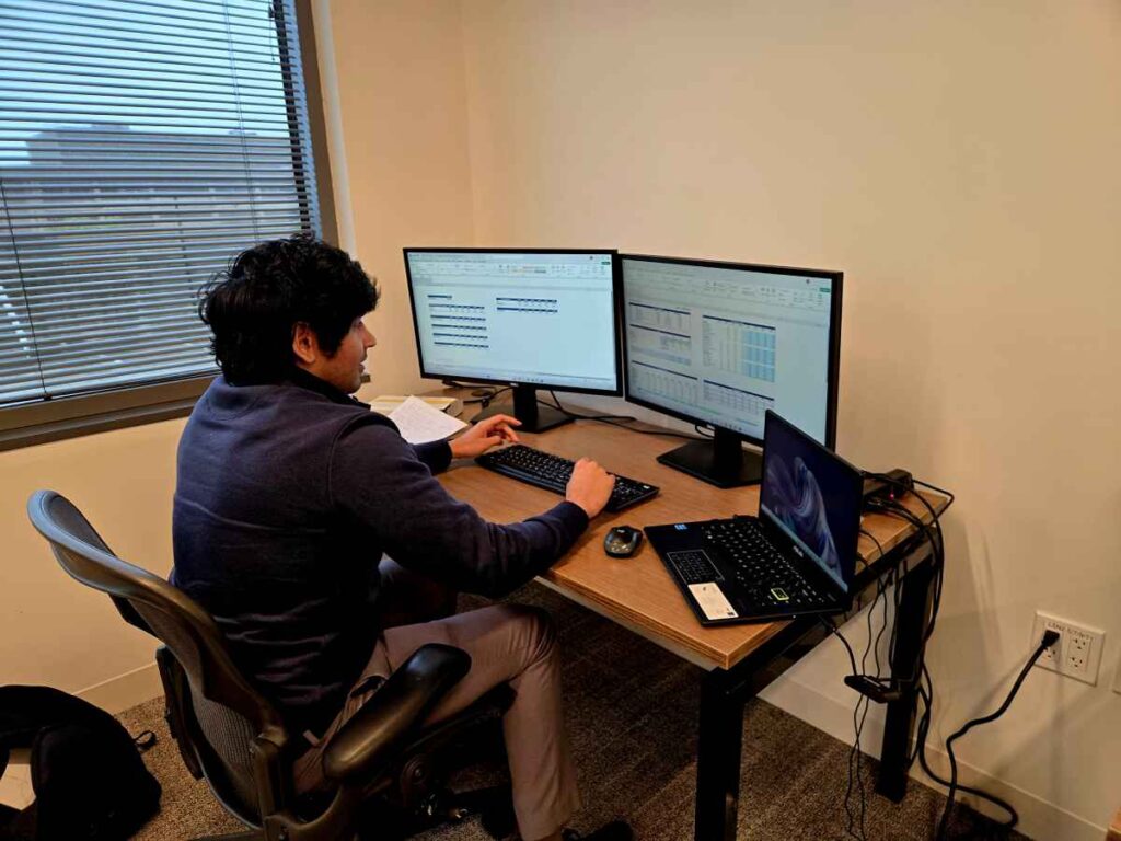 M&A Advisor Working On Desk