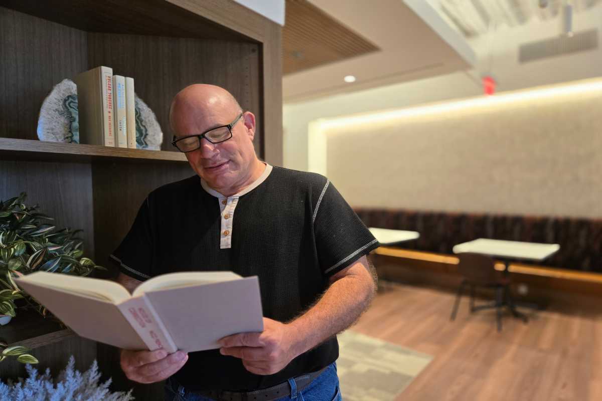 An Expert M&A Advisor Reading Book in Office