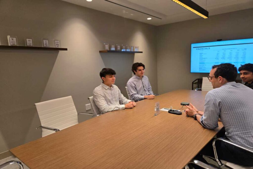 M&A Advisors Discussing Financials in Meeting