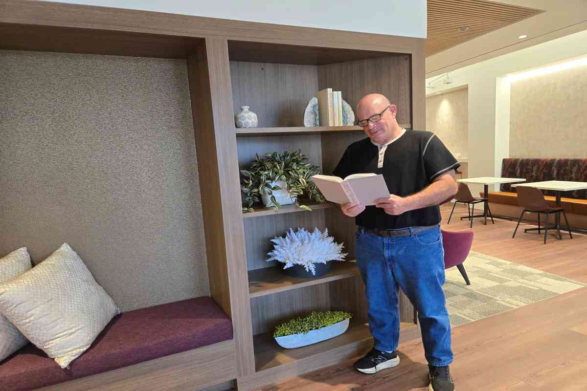 Person Reading Book on M&A Advisory