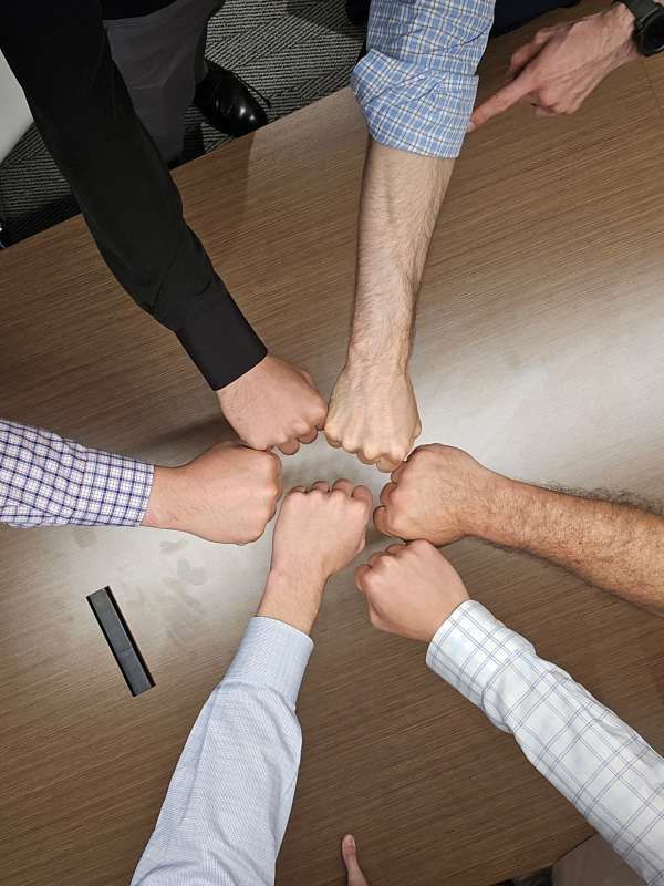 Roadmap Advisors Team Having Fist Bump