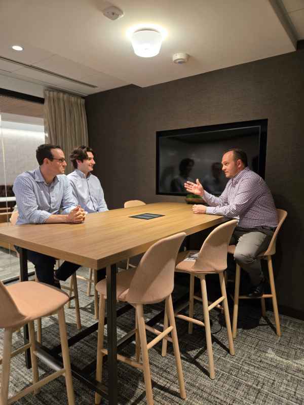 Three M&A Advisors Discussing Infrastructure Services Sector