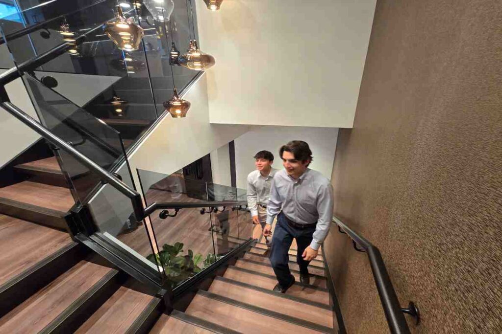 Two M&A Consultants Coming Up From Stairs