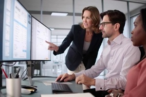 african american woman uses computer software to manage electronic invoices