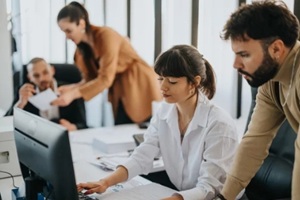 group of coworkers collaborating in a modern office setting
