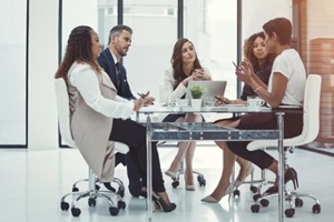 laptop, team and business people in discussion, meeting and pitch ideas in office