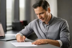 businessman signing some papers