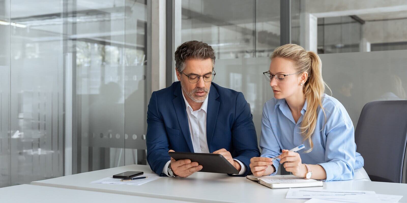two professional business people working together