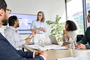 international executive team people having board meeting discussing project results