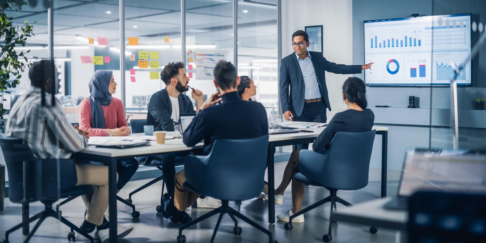 presentation in multi-ethnic office conference room