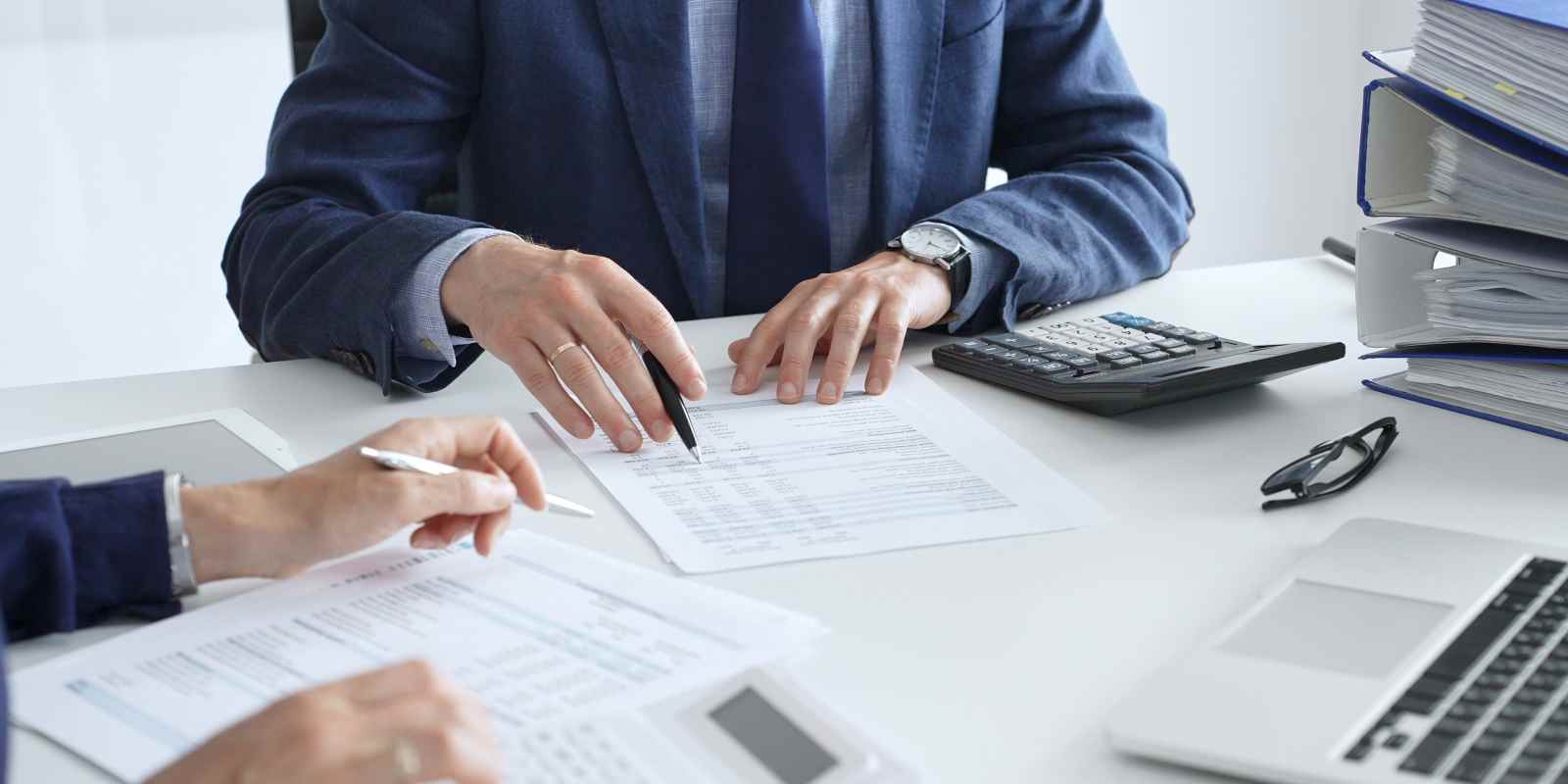 Accountants Analyzing Financial Documents of A Business