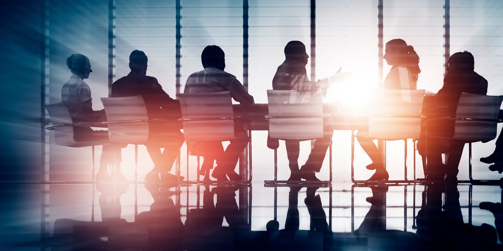 group of business people meeting back lit concept