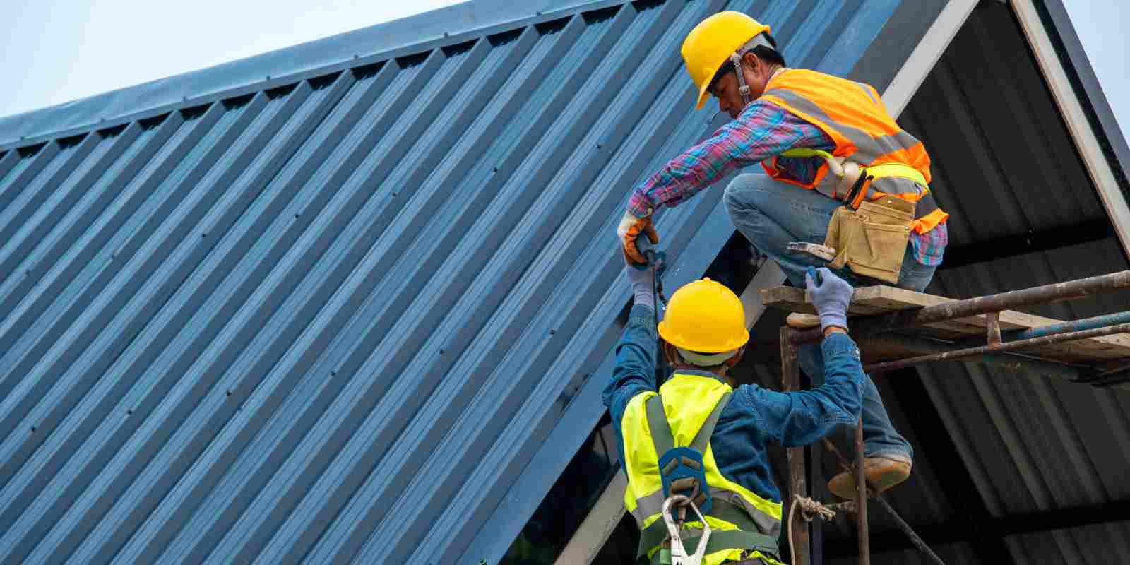 Roofers Working on Roof of New Building