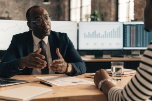 Roofing Business Owner Discussing Pre-Sale Readiness with M&A Advisor