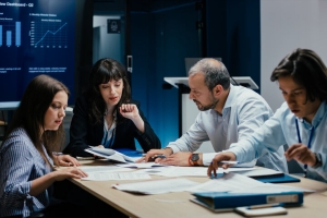 Business Executives and Assistants Brainstorming Business Evaluation