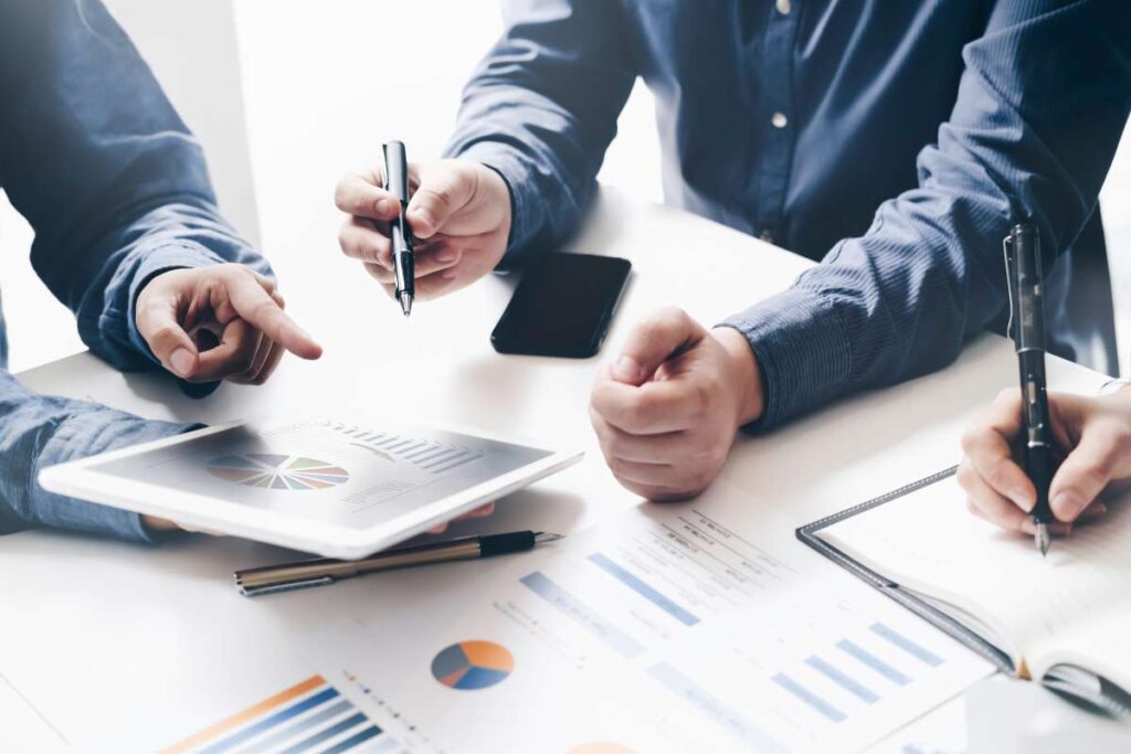Business People Analyzing Financial Reports in Meeting for Value Creation