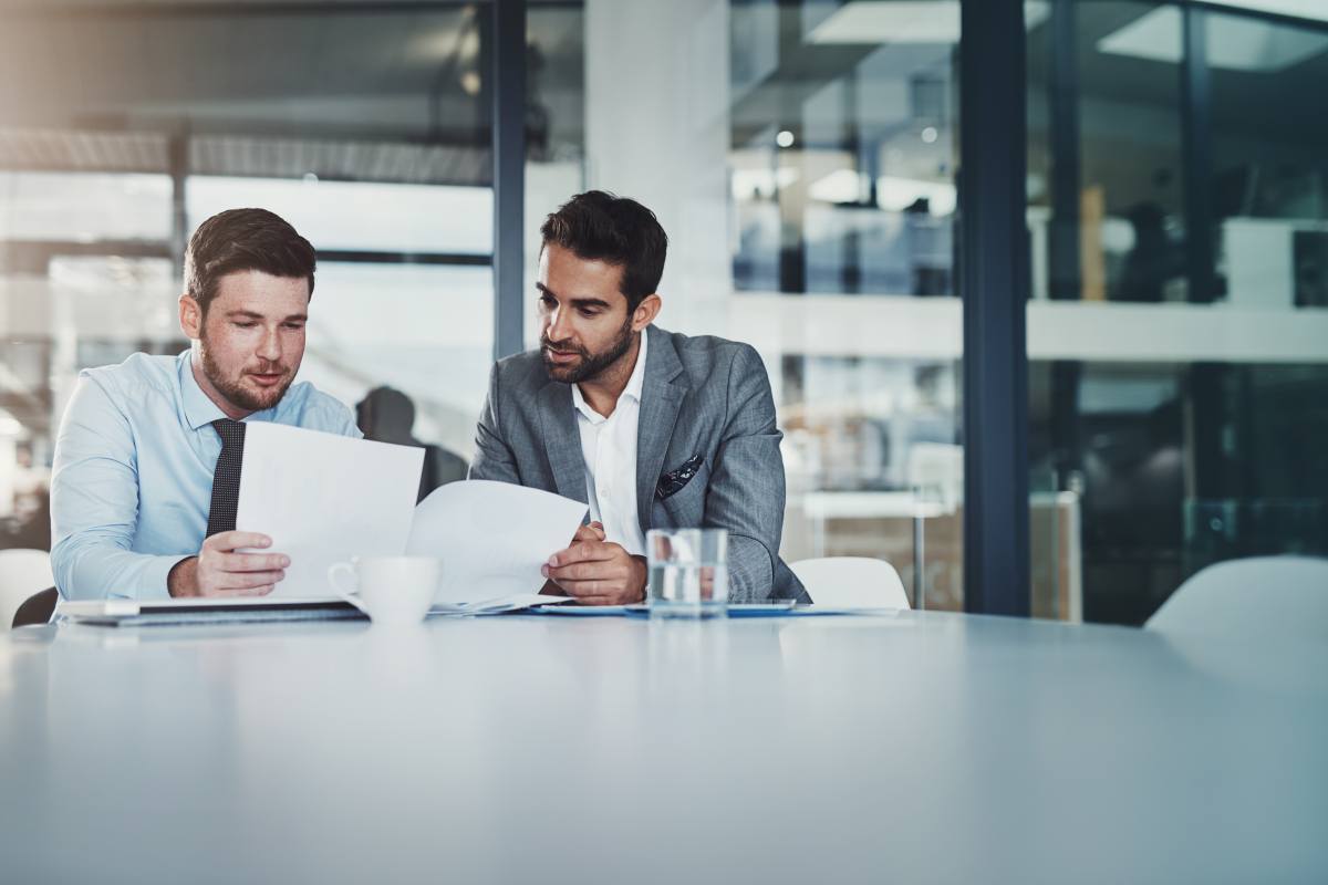 Business People Reviewing Documents for Valuation