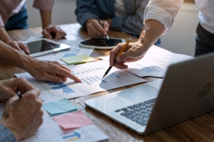 Business Team Analyzing Transaction Charts in Meeting