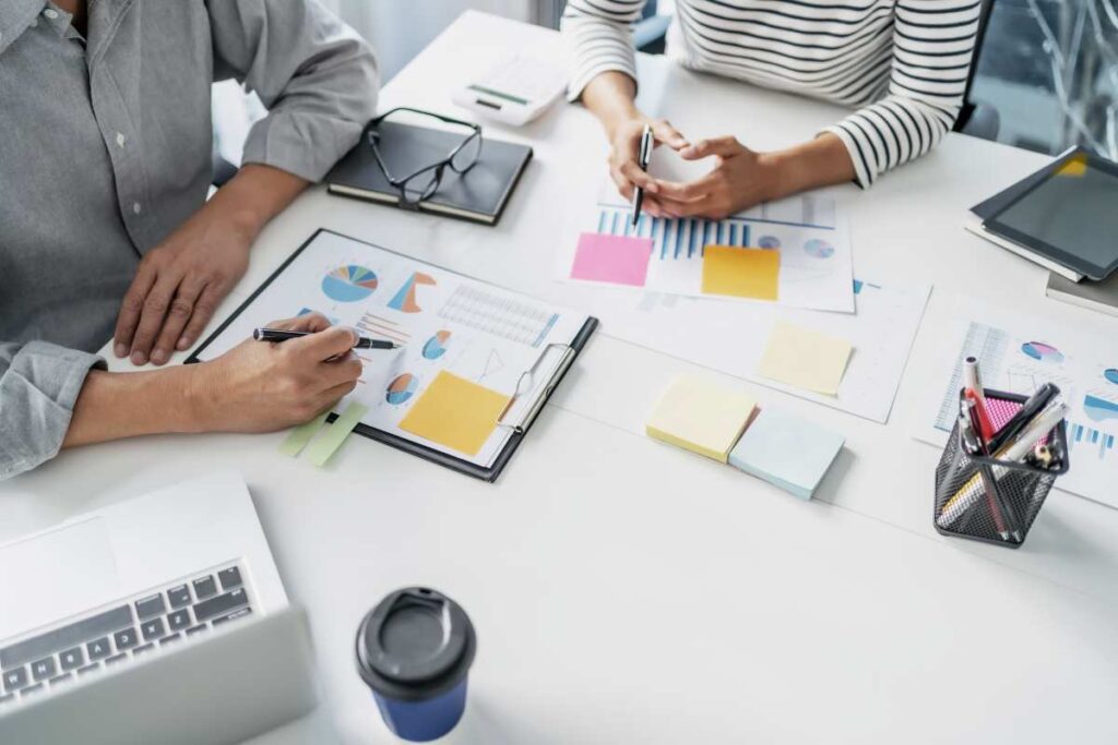Business Team Calculating a Valuation in Office