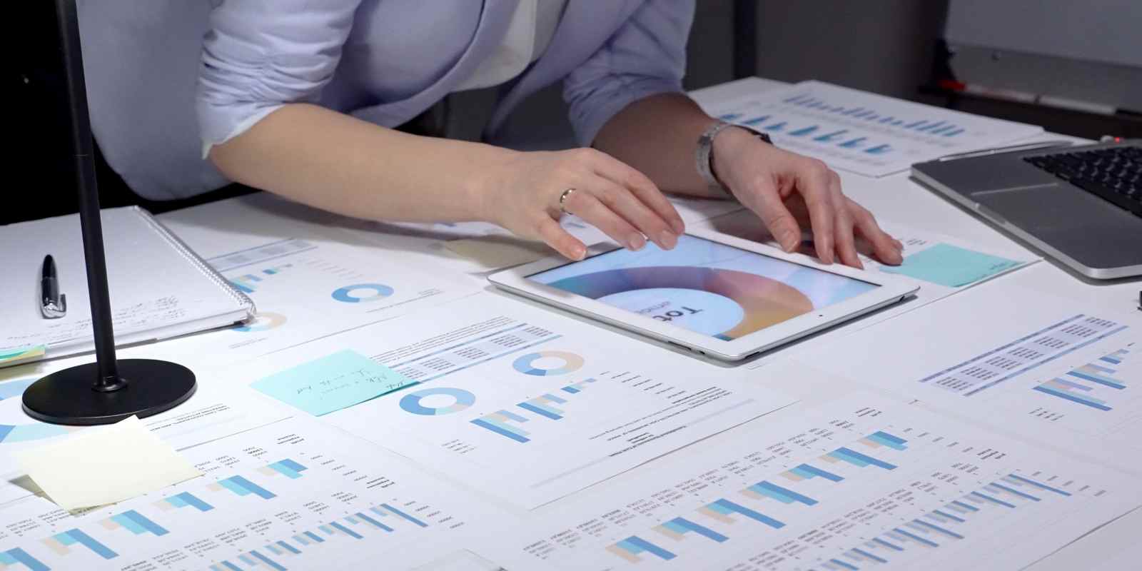 Businesswoman Analyzing Sell-Side Earning Report of Business