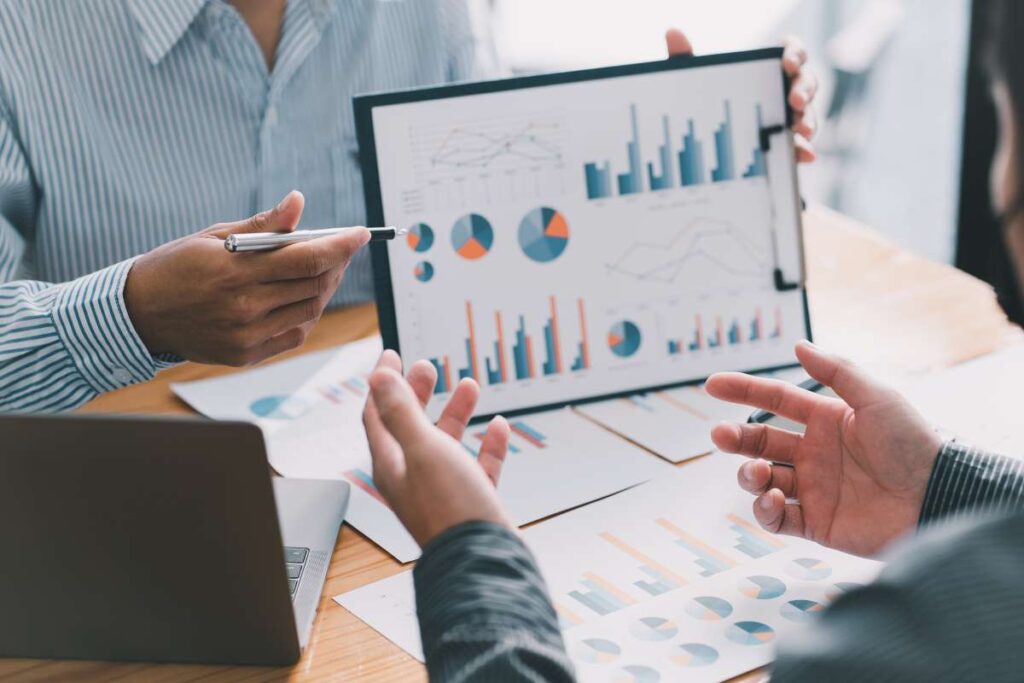 M & A Consultant Explaining Market Testing Financial Data to Business Owner