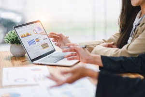 Professionals Analyzing Financial Data Graphs for Business Valuation in Lower Middle Market