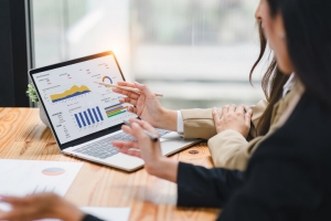 Business People Working on Business Valuation Using Financial Data Charts