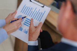 Business Professionals Reviewing Charts for Enterprise Value