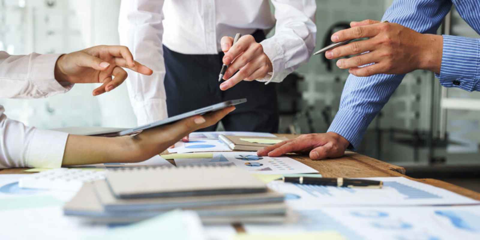 Seller Team Reviewing Middle-Market Business Valuation Data in Meeting