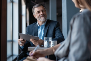 business owner reviewing consulting payments with their team