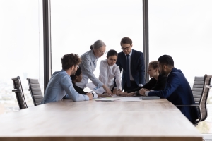 Business Professionals Making Selling Strategy Using Financial Charts in Meeting